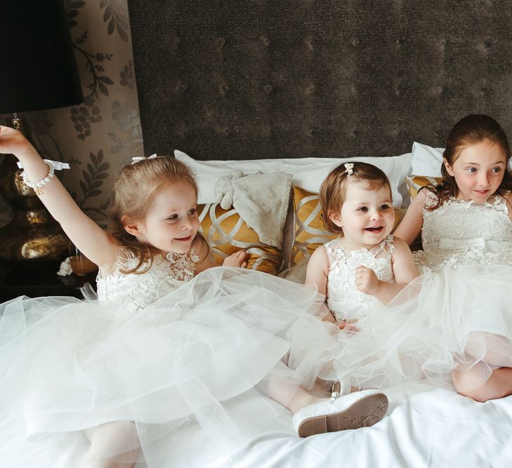 Flower girls in tulle and lace dresses