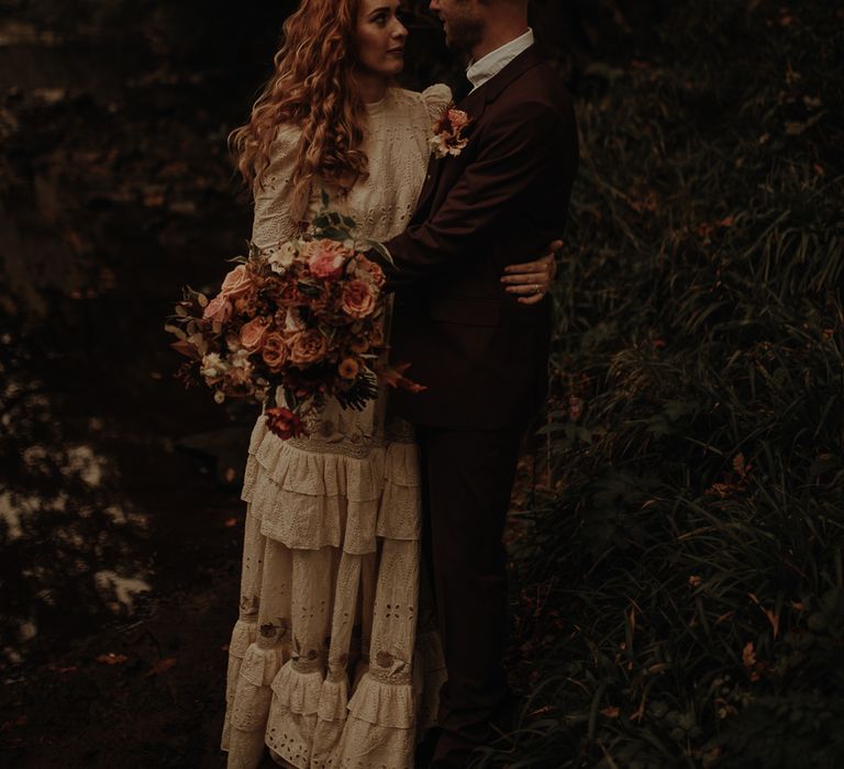 Groom in burgundy suit for Autumn wedding inspiration 