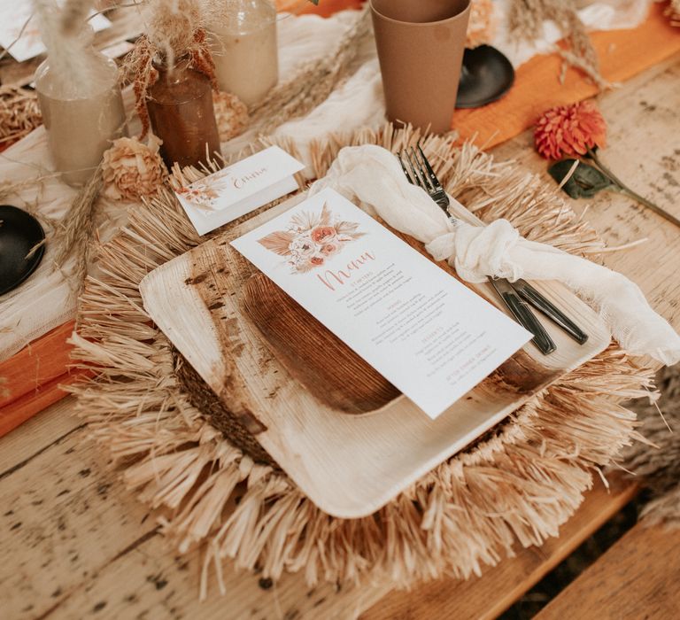 Wooden plates on straw placemats 