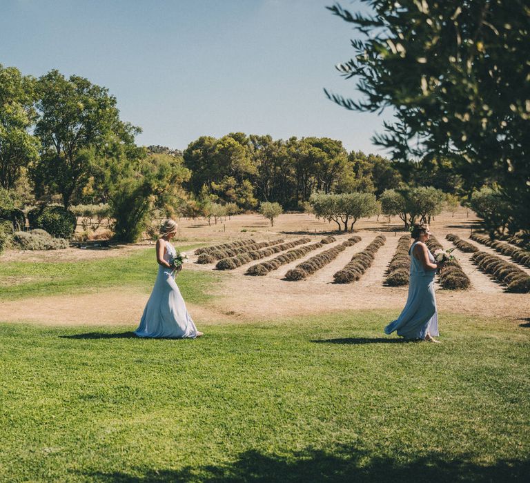 Bridesmaids walking through the fields at Le Mas De La Rose