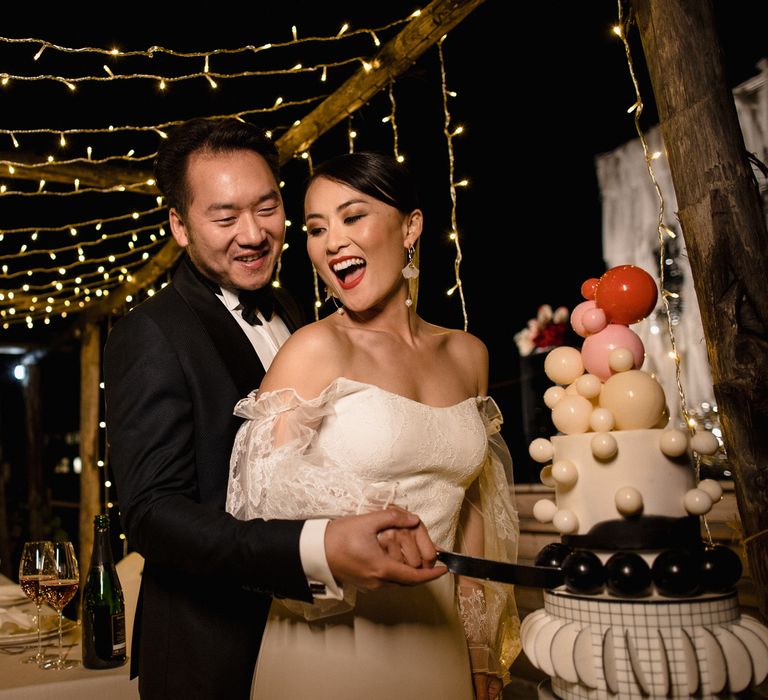 Cutting the cake by A.R.D Bakery