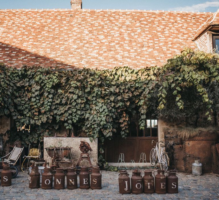 Les Bonnes Joies milk churn sign 