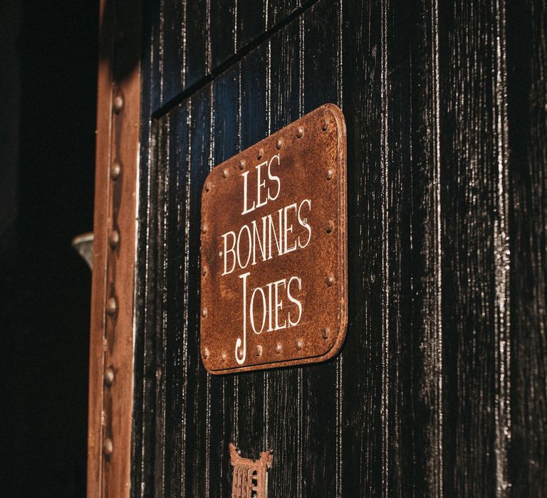 Les Bonnes Joies door sign and knocker. 