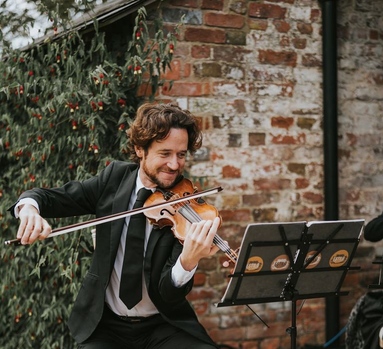 Violinist plays during wedding ceremony