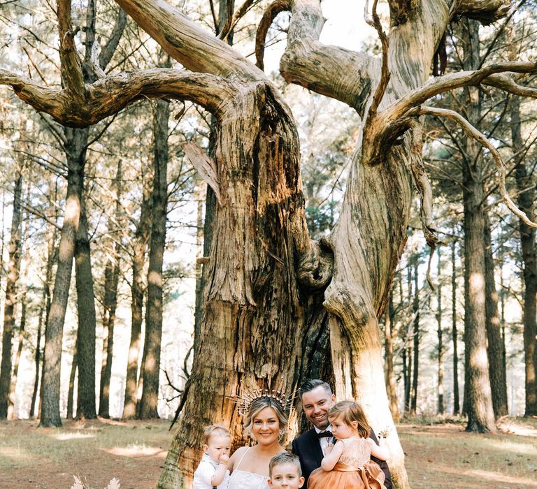 Bride and groom with their family 