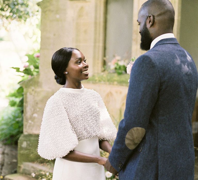 Bride and groom getting married at Barnsley House for an English garden party wedding