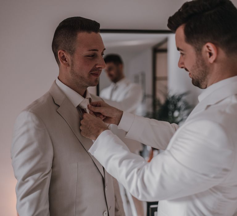 Groom preparation for rooftop wedding 