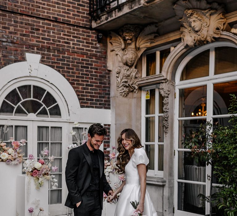 Intimate outdoor wedding ceremony at Dartmouth House weddings venue in Mayfair with blush wedding flowers 