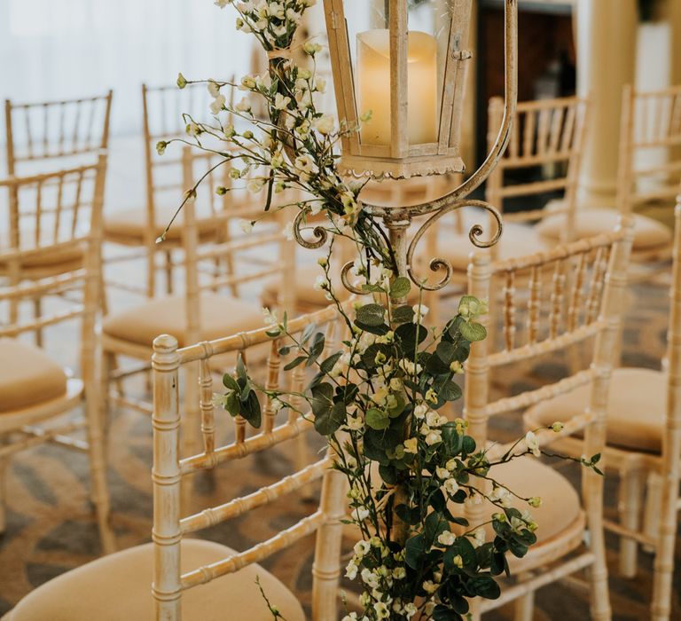 Vintage lantern wedding decor with white flowers