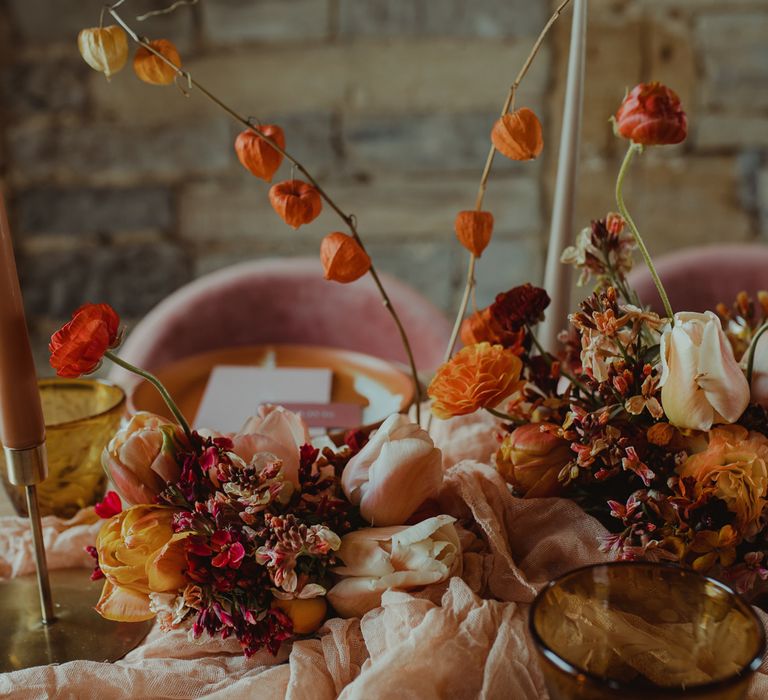 Blush and orange wedding flower table decor