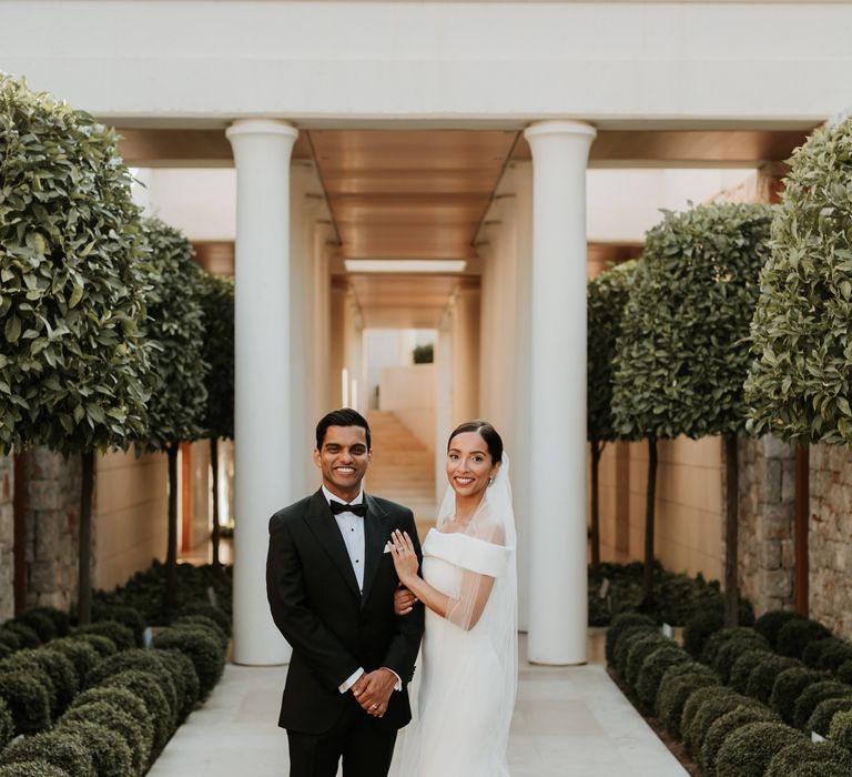 Bride & groom stand in front of Villa 20 surrounded by lush green trees on their wedding day | Hannah MacGregor Photo & Film