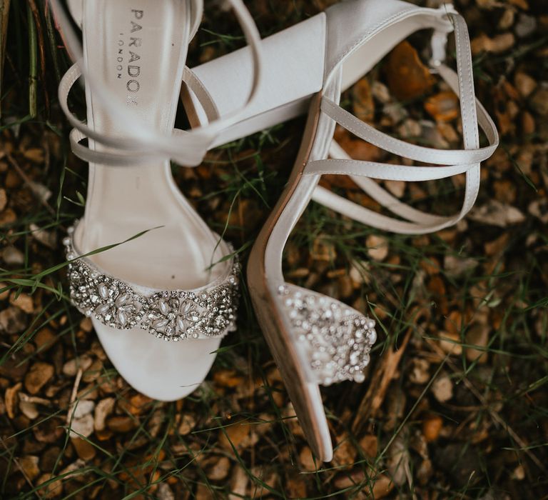 White heeled sandals with diamanté encrusted strap outside at late summer wedding in Norfolk