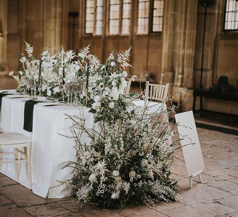 White and green wedding flower arrangement with roses, anemones and astilbe 