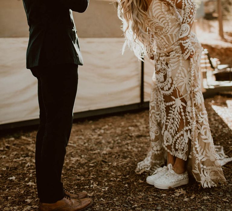 Bride & groom laugh with one another on their wedding day