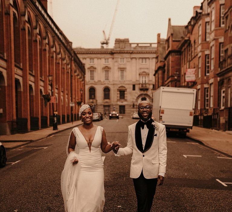 Birmingham wedding with Black bride and groom in a vintage style wedding dress and white tuxedo jacket 