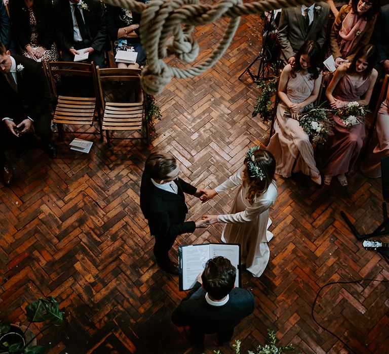 Birdseye image of bride & groom during wedding ceremony