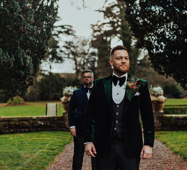 Grooms for LGBTQI+ wedding walking the grounds of the Castle Leslie Estate venue 