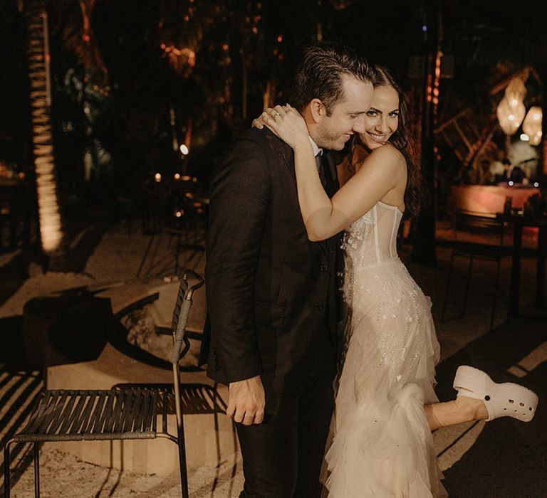 Bride wears white platform Crocs on her wedding day