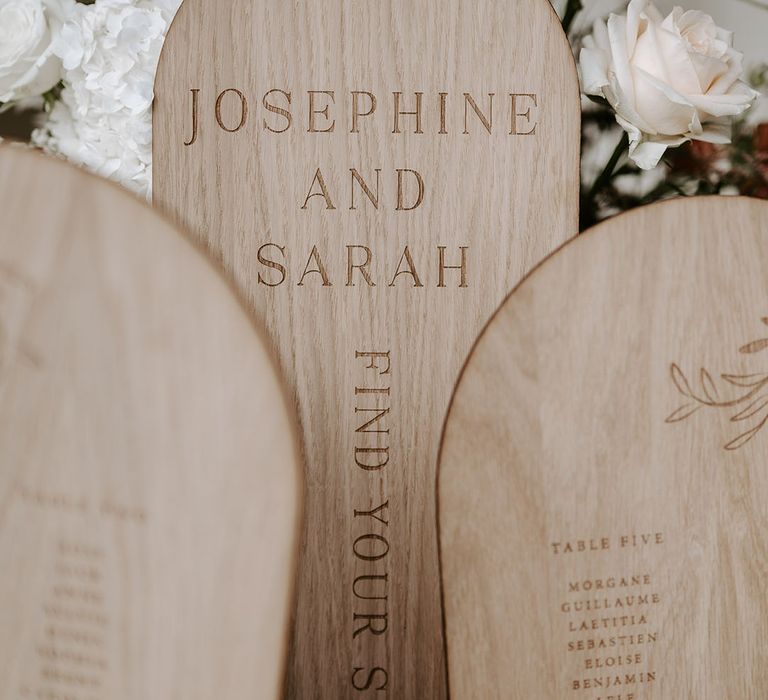 Light wood arched wedding table plan 