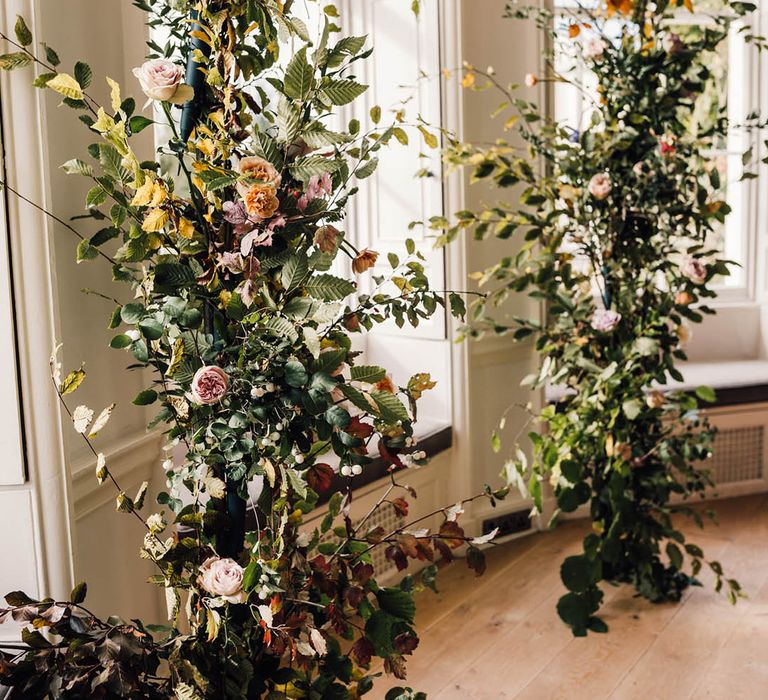 Wildflower wedding column flower arrangements with roses 