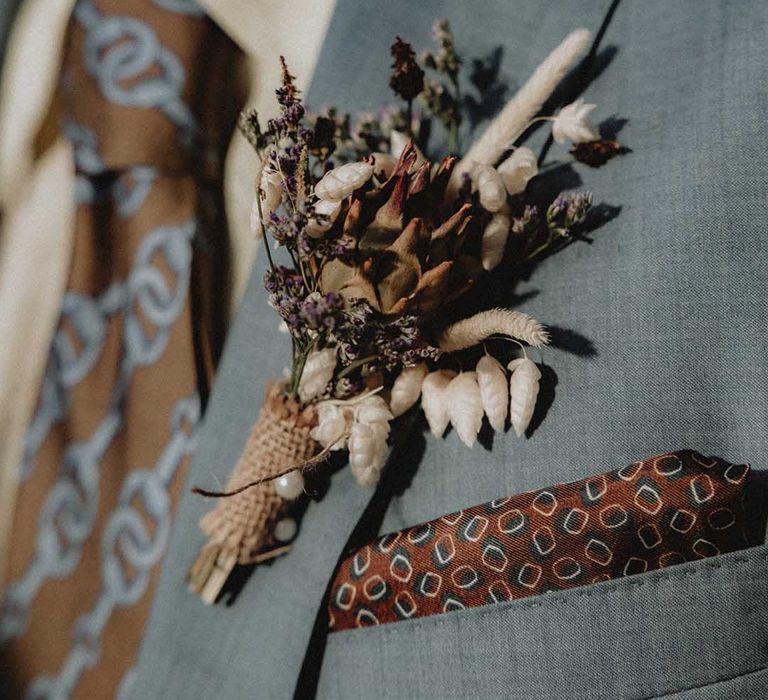 DIY wildflower buttonhole in powder blue Gucci suit 