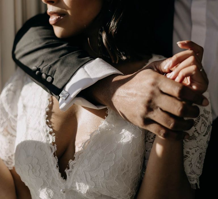 Bride and groom embracing at Yorkshire wedding venue, doing golden hour wedding photoshoot 