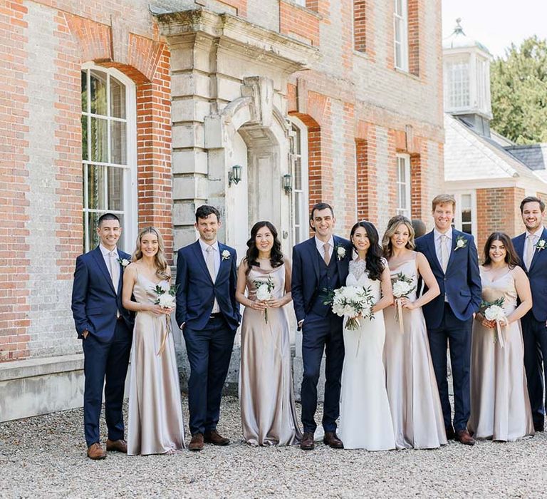 pink bridesmaid dresses and navy groomsmen suits wedding party outfits 