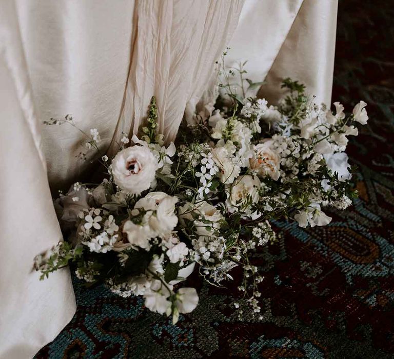 white wedding flower arrangement with foliage 