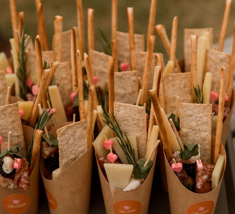 DIY charcuterie cups made by the bride for the wedding guests to eat 