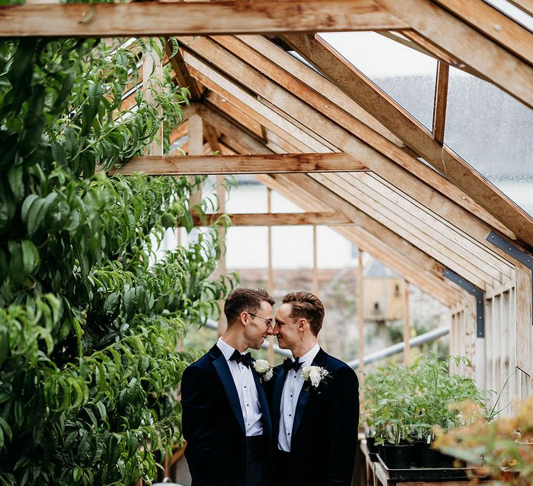 Couple portrait of two grooms at gay wedding at luxe country house wedding venue 