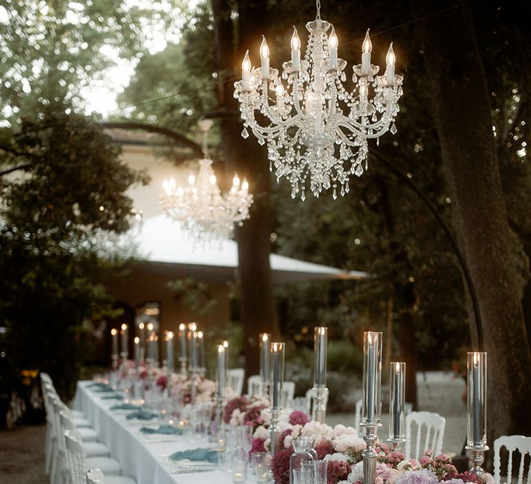 Outdoor pastel theme fairytale wedding in Tuscany with romantic wedding tablescape 