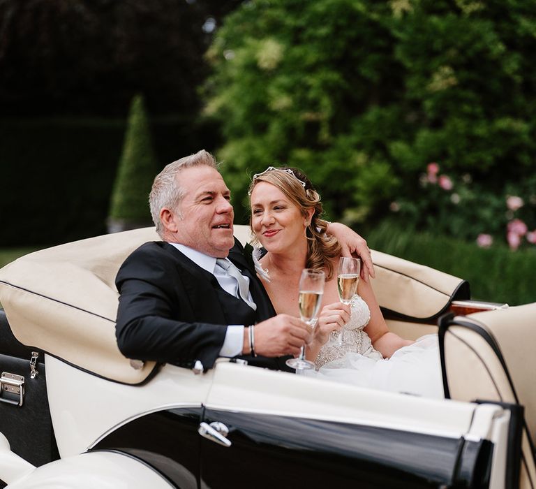 Black and cream vintage wedding car transportation 