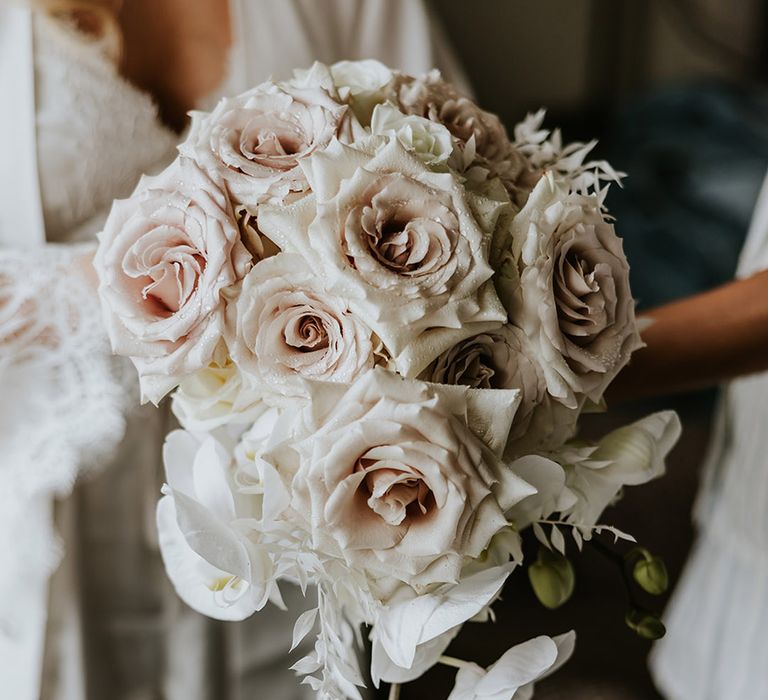 Pale pink rose bouquet with white orchids for neutral theme wedding 