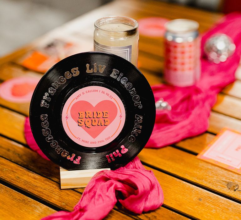 Vinyl record wedding table names with retro lettering to match the wedding theme