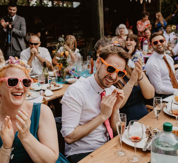 Wedding guests in sunglasses at eclectic wedding