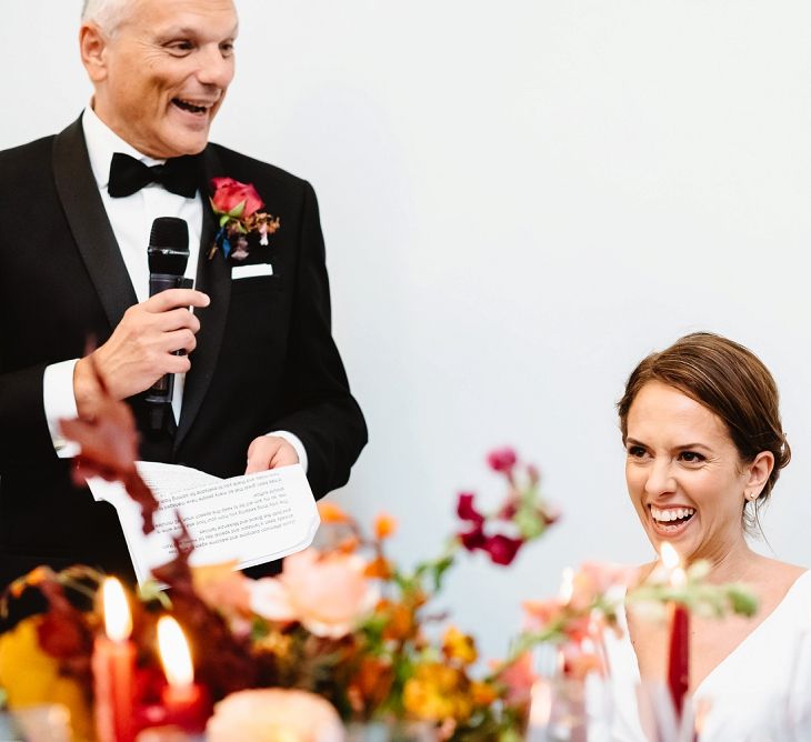 Bride smiling during the Father of The Bride speech