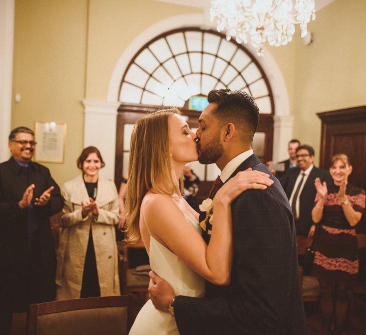 Newly-wed couple kissing at London Townhall Wedding 