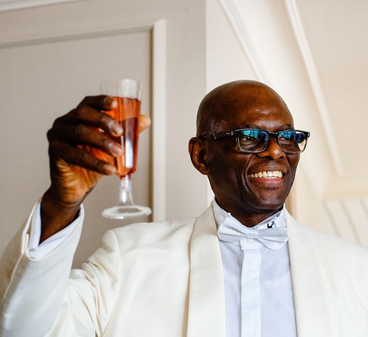 Father of the bride in white dinner jacket 