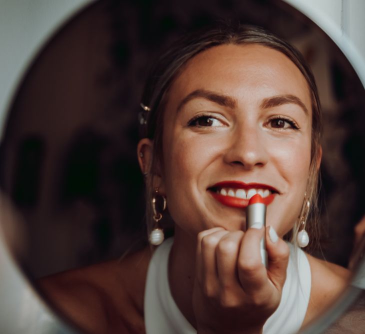 bride wearing bright red lipstick 