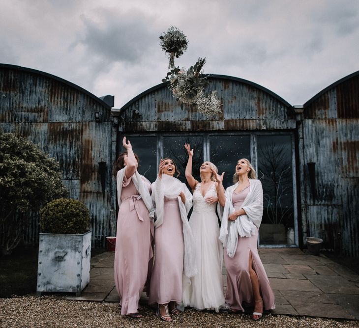 Pink bridesmaid dresses for stone barn wedding in spring