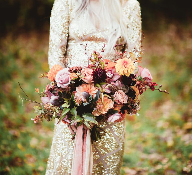 Bride with metallic crown in sequin dress and oversized bouquet. Photography by Maryanne Weddings.