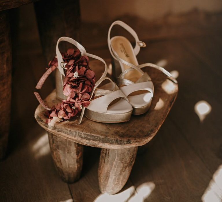 White and gold platform high heels with flower headband