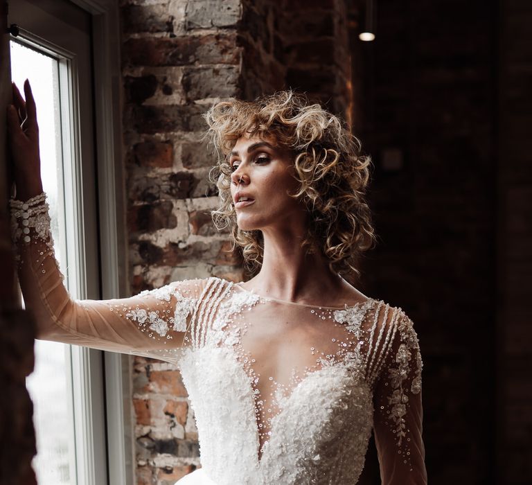 The bride wore her hair short and curly for a 70s inspired wedding day look