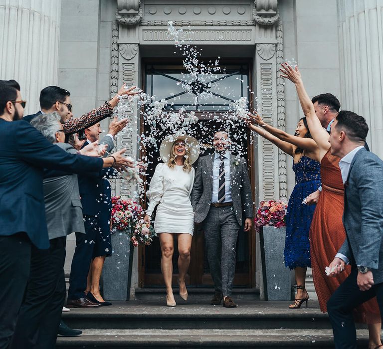 Marylebone wedding confetti moment bride wears Net a Porter Wedding dress 