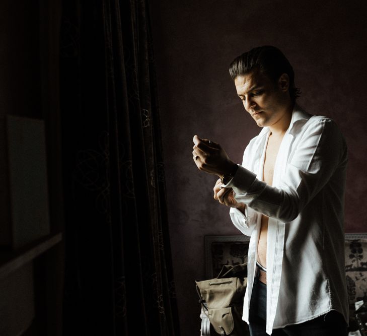 Groom gets ready on the morning of his wedding