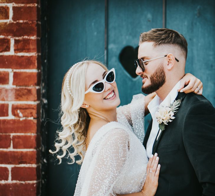 Bride and groom portraits in stylish sunglasses 