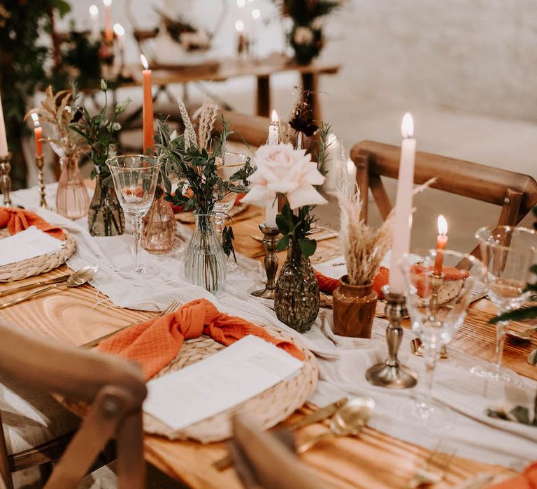 Autumnal tone wedding table decor with linen napkins and romantic candles