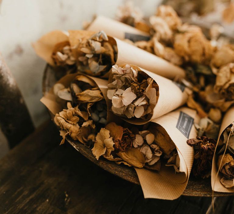 Brown paper cones of natural dried flower confetti