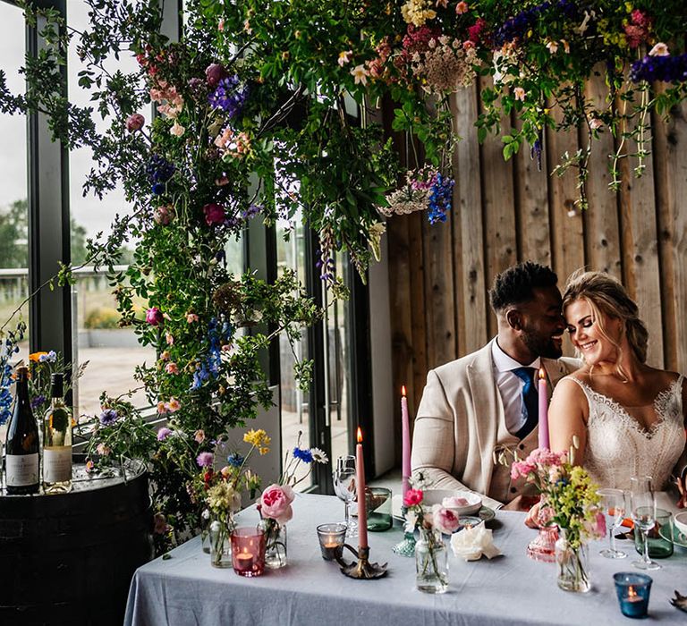 Little Wold Vineyard wedding reception with colourful wildflower decoration 