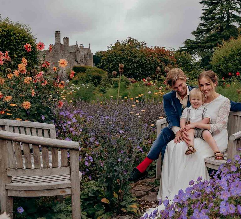 Family photo amongst the wildflowers at country house wedding venue in Devon